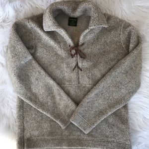 Soft fleece with leather tie.